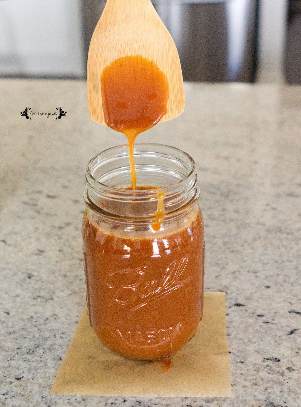 Create a Salted Caramel Apple Bar with this decadent Salted Caramel sauce and your favorite sweet and savory toppings. | Five Marigolds