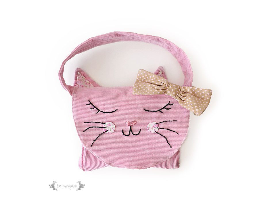 Upcycle your baby clothes with this pants - to - kitty cat purse refashion tutorial.
