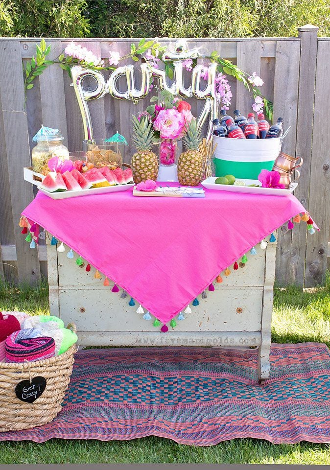 Chill and grill for a laid back summer barbecue. Tutorial for turning a dollar store tablecloth into a custom memory blanket for gatherings. Free printable favor tags for sparklers. 