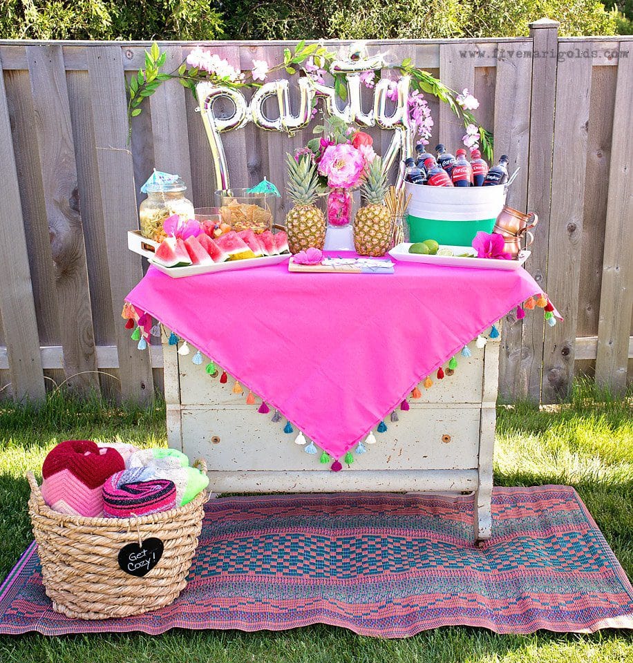 Chill and grill for a laid back summer barbecue. Tutorial for turning a dollar store tablecloth into a custom memory blanket for gatherings. Free printable favor tags for sparklers. 