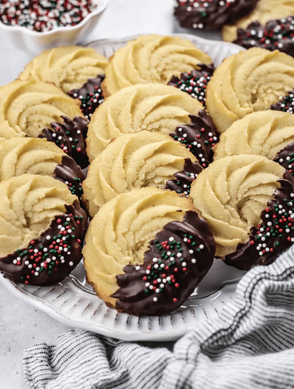 Danish butter cookies dipped in chocolate and red and white sprinkles