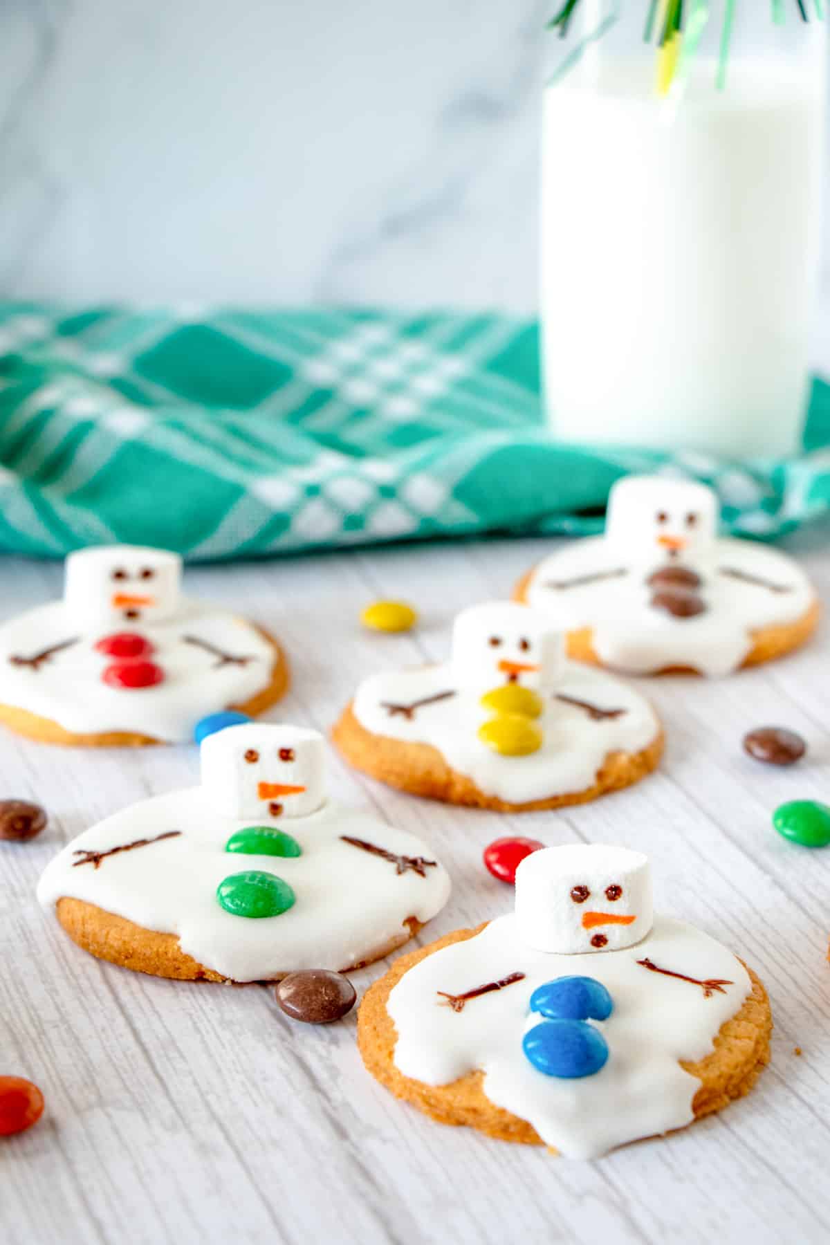 melted snowmen with colorful candy buttons
